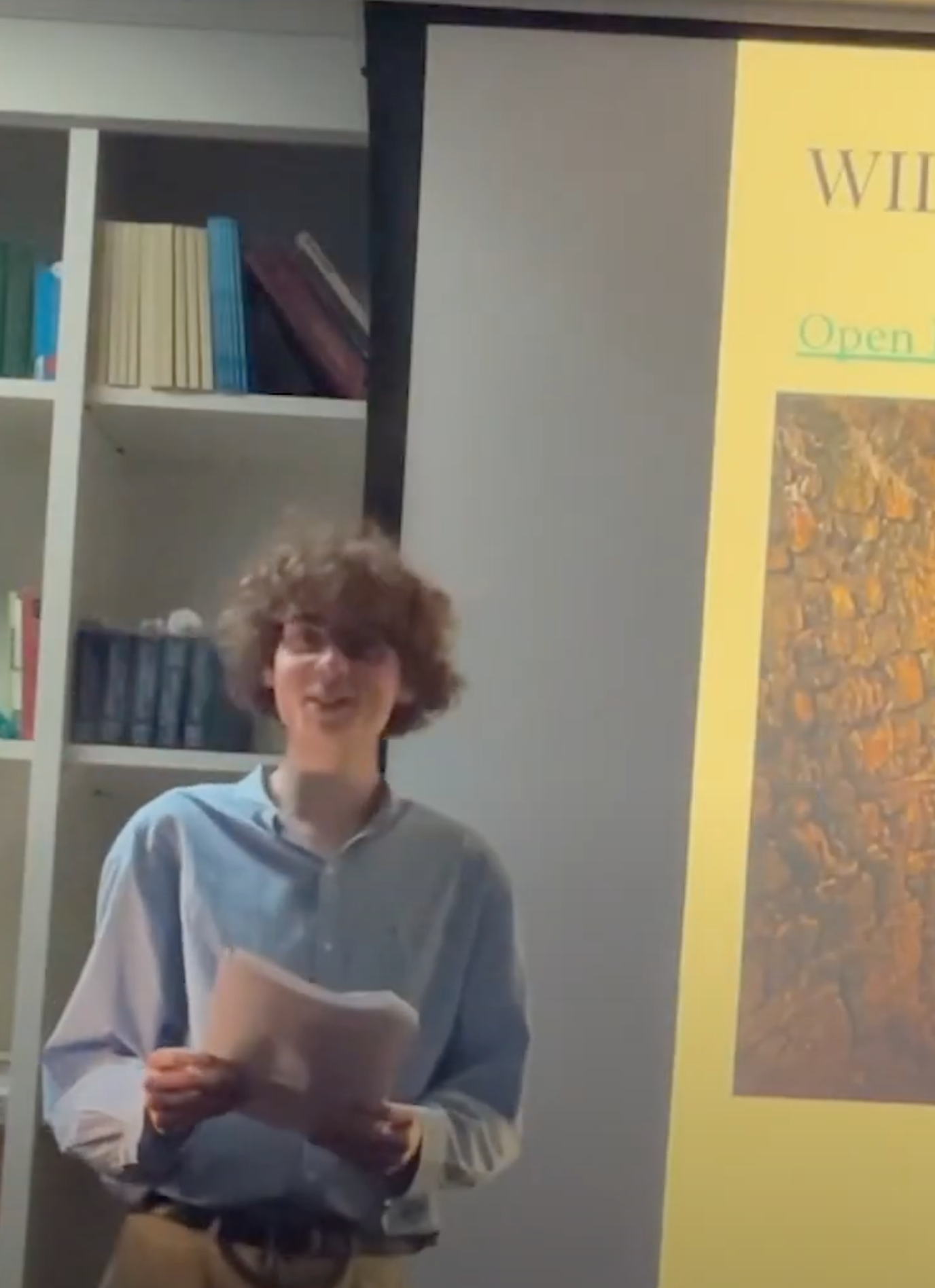 The composer TEACHES, grinning.